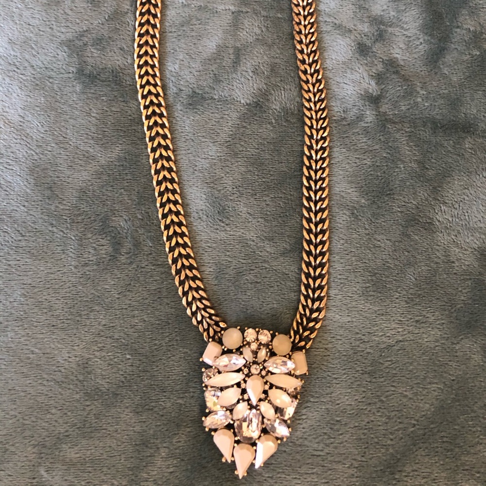 Gold and cream pendant necklace